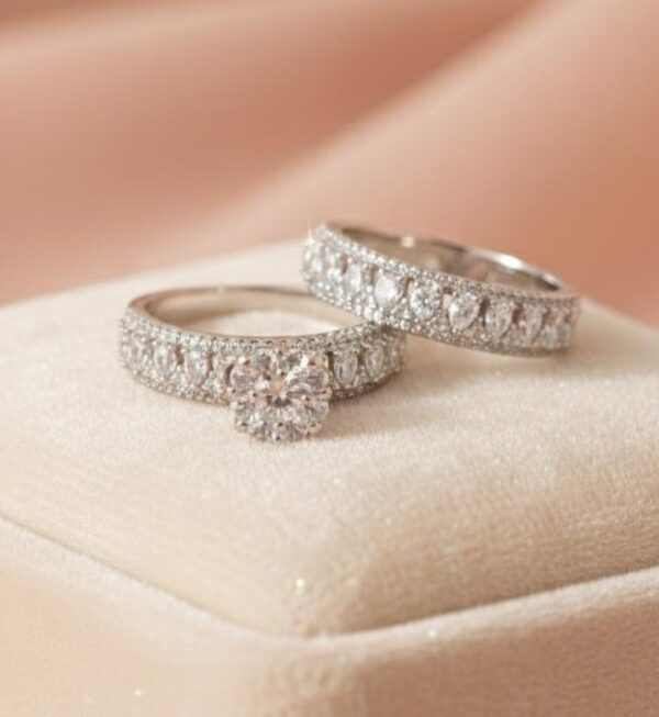 Sleek High-Shine Round Solitaire with Pear-Accent Textured Bands in Sterling Silver 925