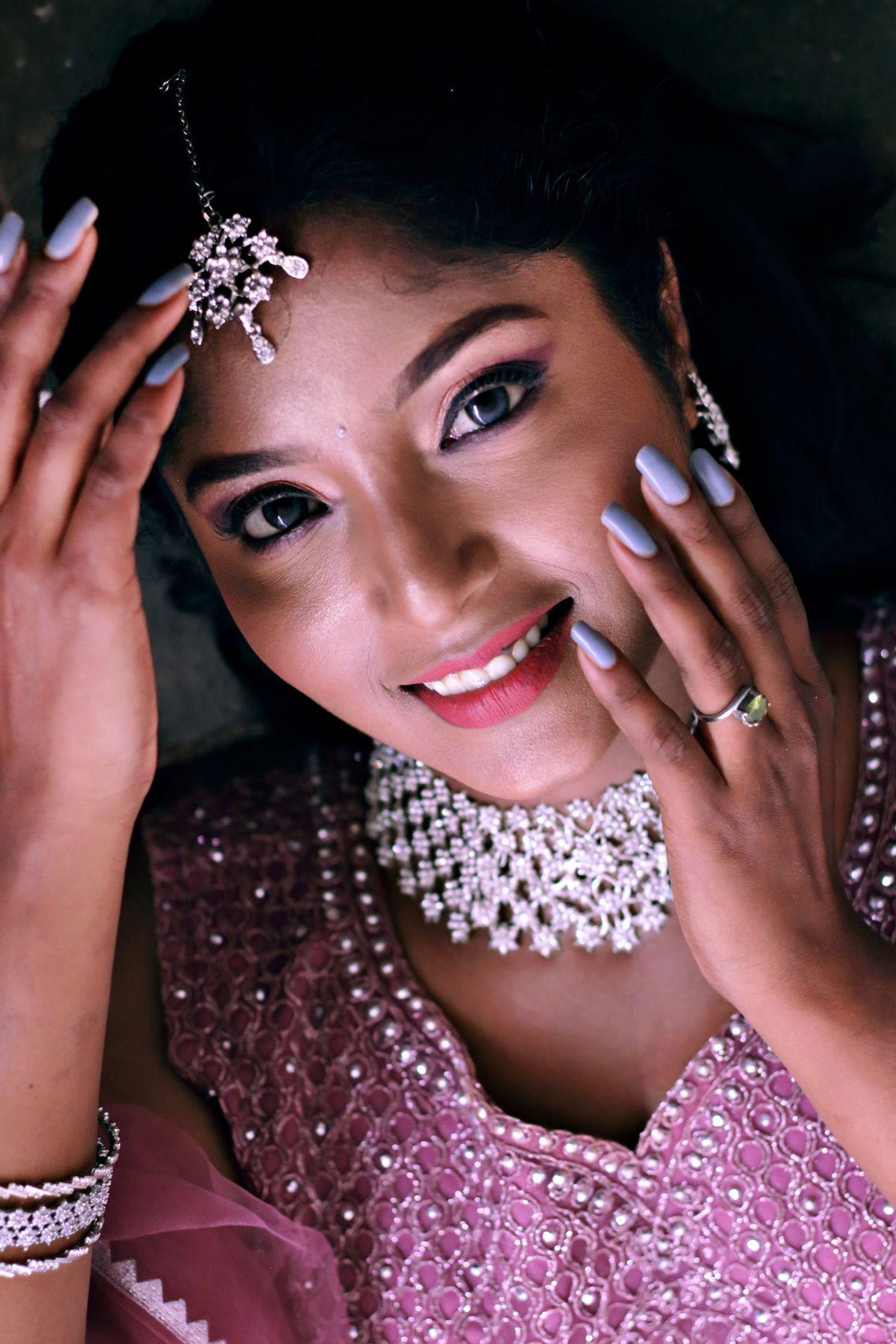 Indian woman wearing traditional silver jewelry and festive attire
